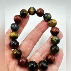 12mm red, black, blue, and yellow tigers eye stone stretchy bracelet!